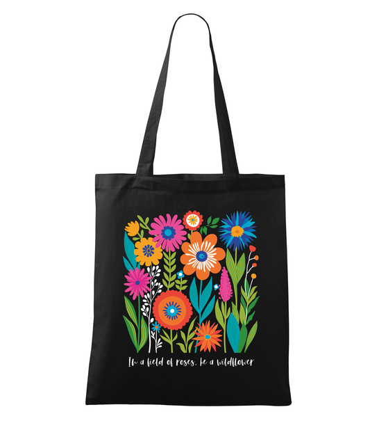 Black tote bag with colorful floral design and text on a white background