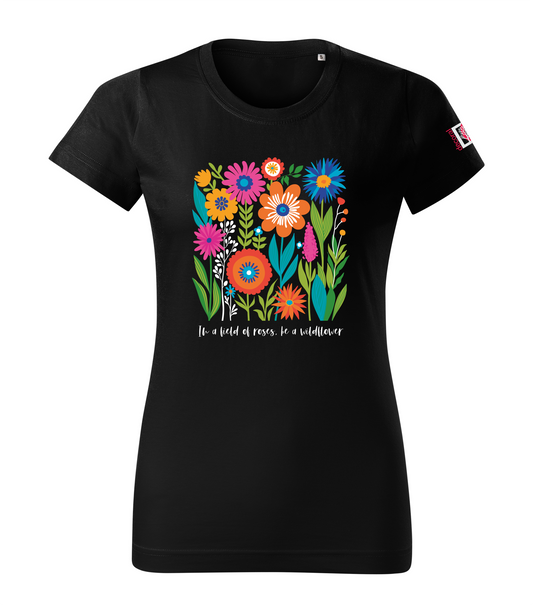 Black floral T-shirt with text saying In a field of roses be a wildflower